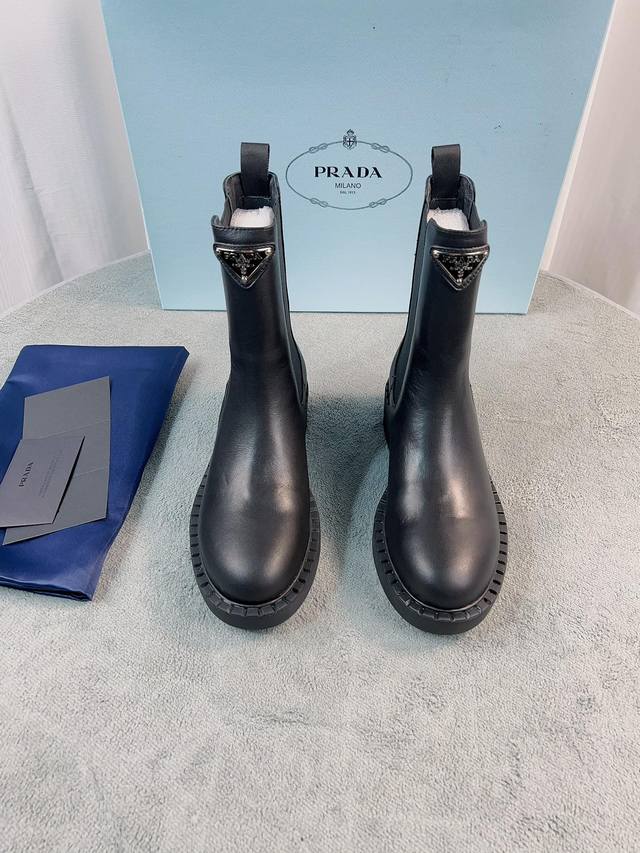 Prada's latest ankle boot series. Upper: Imported calfskin, patent leather, spli