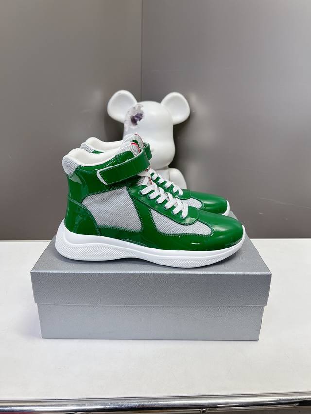 Prada premium high-top sneakers. Features include an imported flyknit upper with