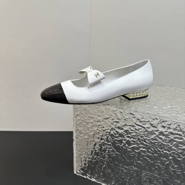 Chanel Mary Jane shoes with pearl heels and bows, perfectly blending classic ele