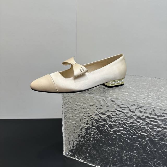 Chanel Mary Jane shoes with pearl heels and bows, perfectly blending classic ele