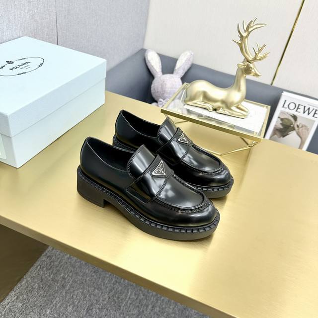 Top-tier version, Prada patent leather lace-up platform loafers. Upper: Enameled