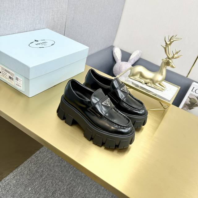 Top-tier version, Prada patent leather lace-up platform loafers. Upper: Enameled