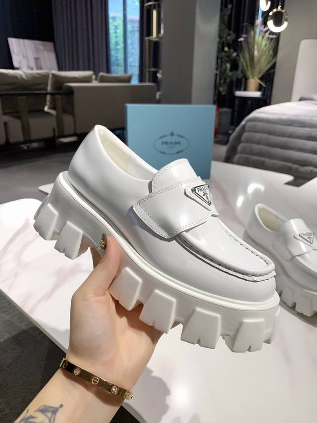 Prada 's newest runway product with metal triangle logo! This year's Prada desig