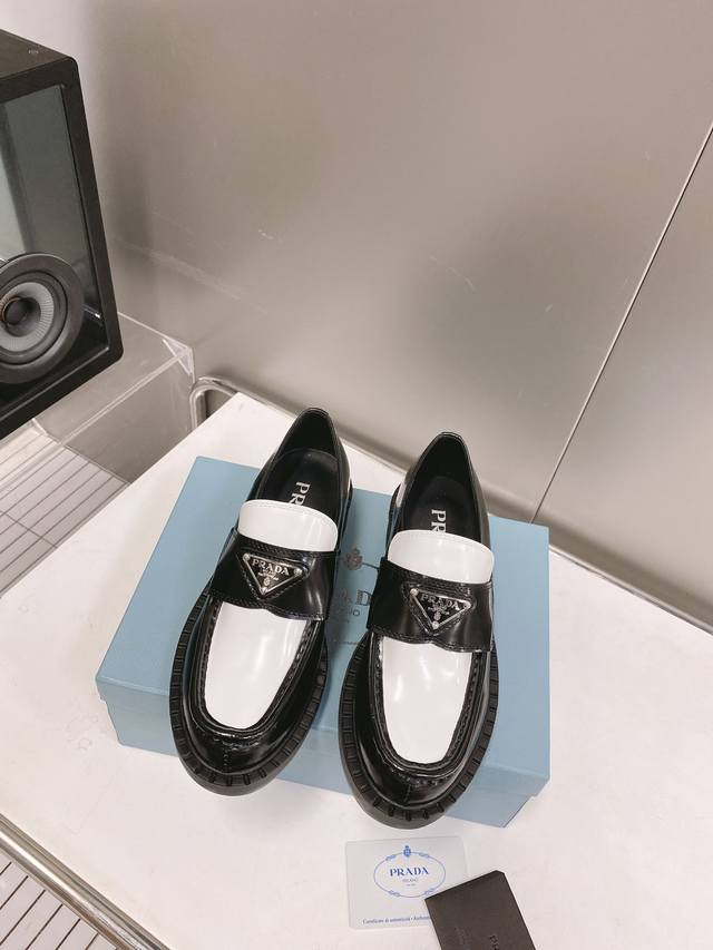 This color is only available for order. Prada SS22 Panda Triangle Logo Loafers.