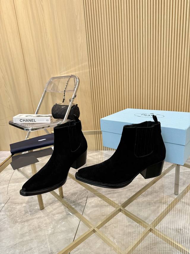 Top-tier luxury version of the classic Prada pointed-toe boots. Prada is perfect
