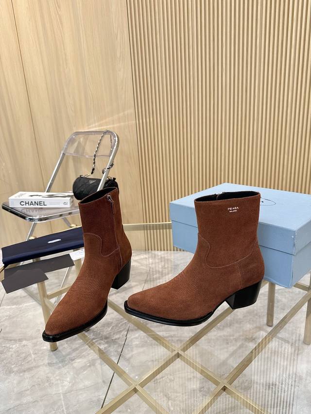 Top-tier luxury version of the classic Prada pointed-toe boots. Prada is perfect