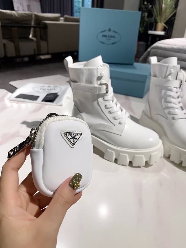 White, no returns or exchanges. Prada launches its latest bag, ankle boot, and p