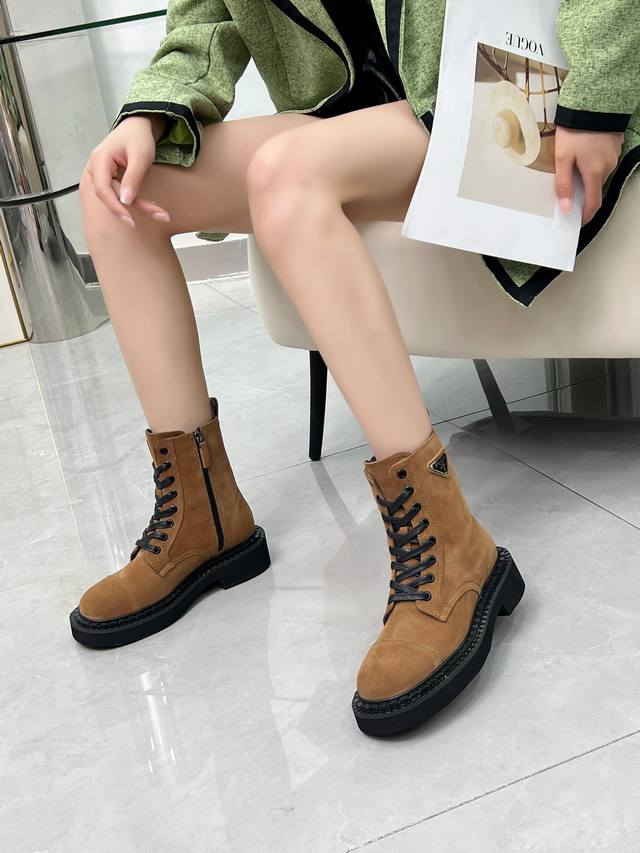 Prada's classic triangle logo Dr. Martens boots. This year's hottest style. Styl