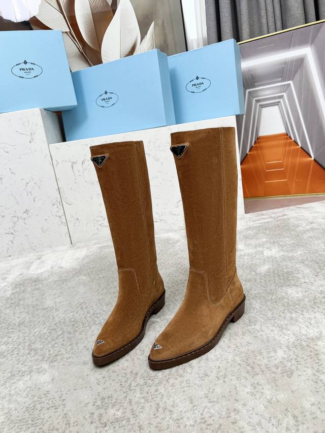 Top-tier luxury version of the classic Prada triangle logo pointed-toe boots. Pr