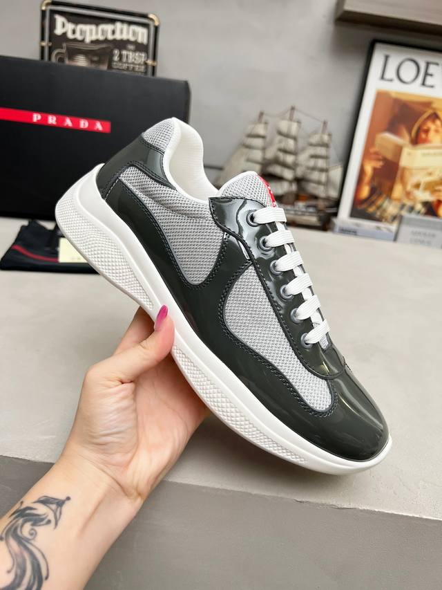Prada top-of-the-line sneakers. Features include an imported flyknit upper with