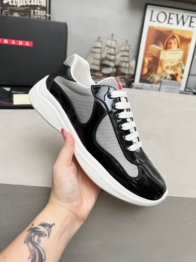 Prada top-of-the-line sneakers. Features include an imported flyknit upper with