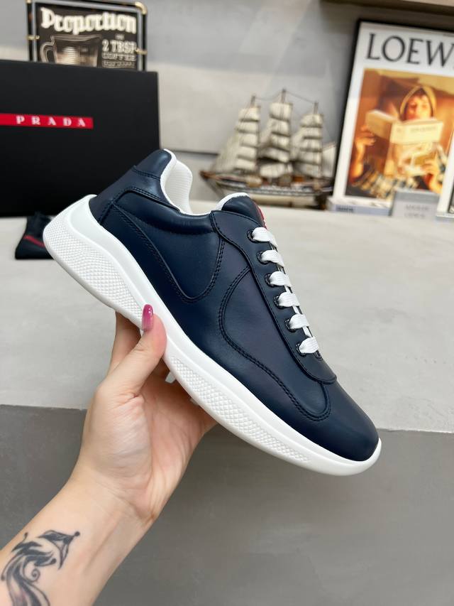 Prada top-of-the-line sneakers. Features include an imported flyknit upper with