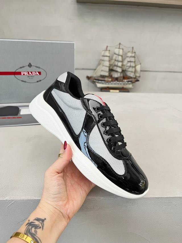 Prada top-of-the-line sneakers. Features include an imported flyknit upper with