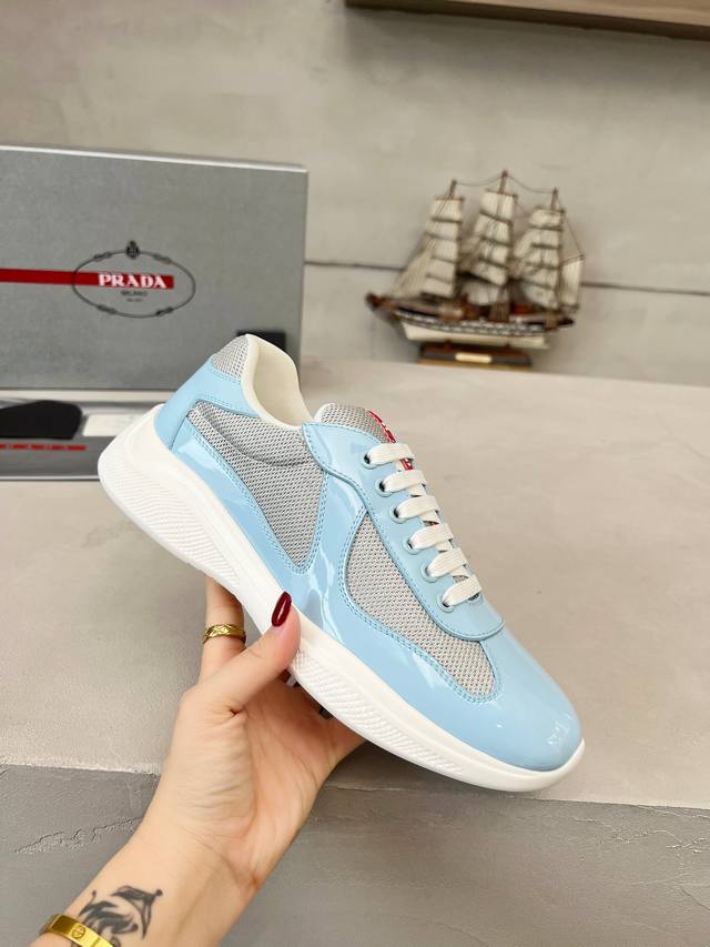 Prada top-of-the-line sneakers. Features include an imported flyknit upper with