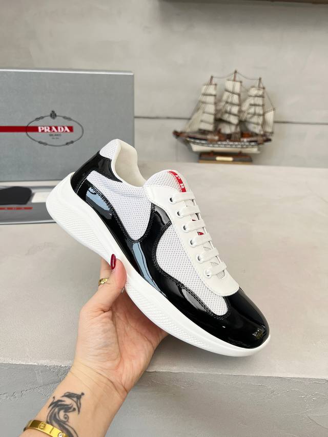 Prada top-of-the-line sneakers. Features include an imported flyknit upper with