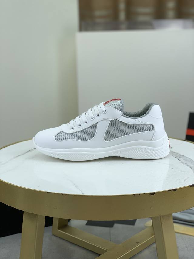 Prada Top-Tier Sneakers. Upper: Imported flyknit fabric combined with soft rubbe
