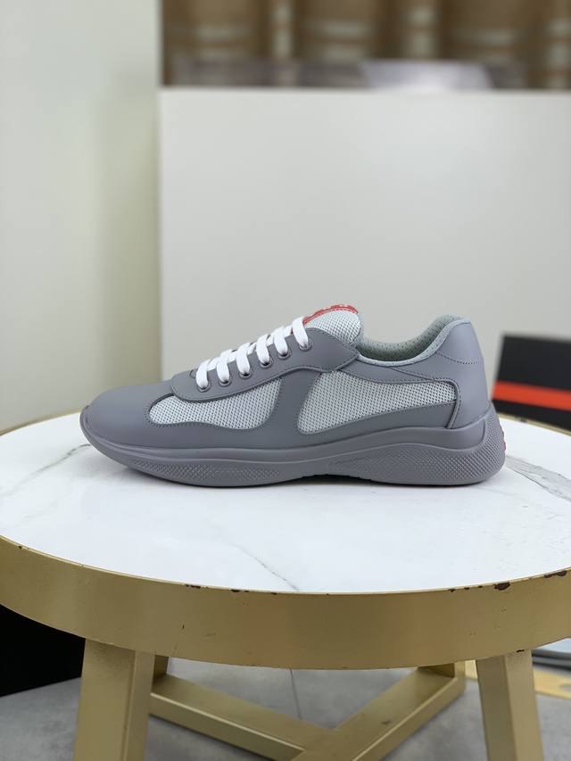 Prada Top-Tier Sneakers. Upper: Imported flyknit fabric combined with soft rubbe