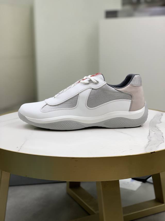Prada top-of-the-line sneakers. Features include an imported flyknit upper with