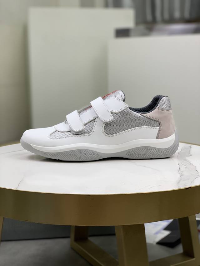 Prada top-of-the-line sneakers. Features include an imported flyknit upper with