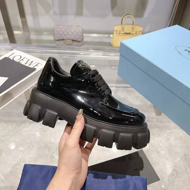 Prada's new black platform calfskin casual shoes with open-toe beading and leath