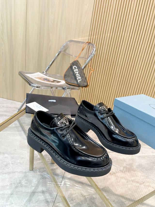 Prada Fall/Winter runway show and influencer-endorsed loafers. Prada's "Dream Ci