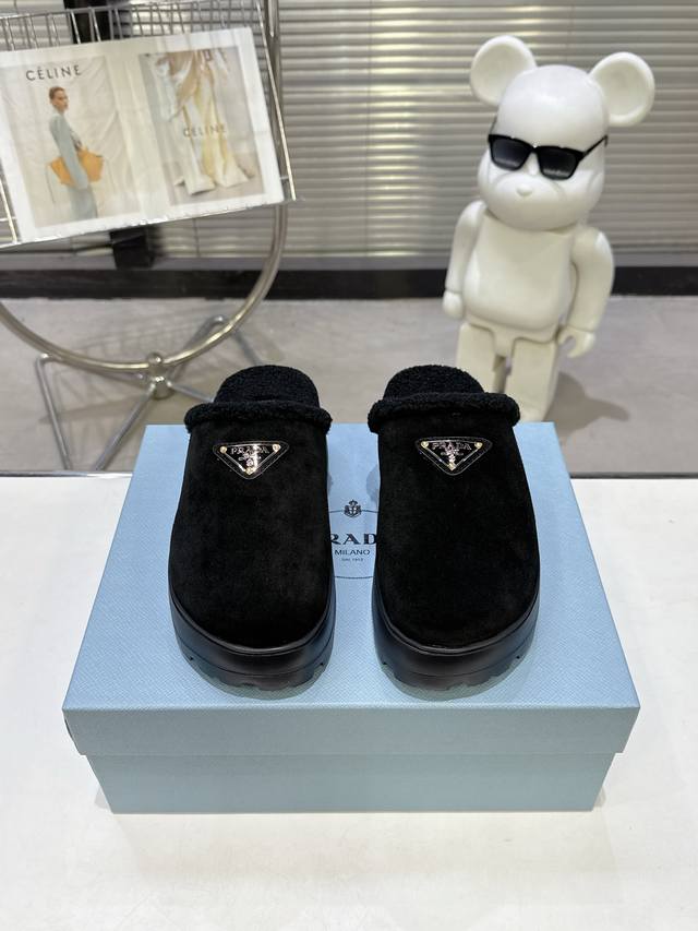 Prada's popular autumn/winter closed-toe sheepskin slippers. A runway item, suit
