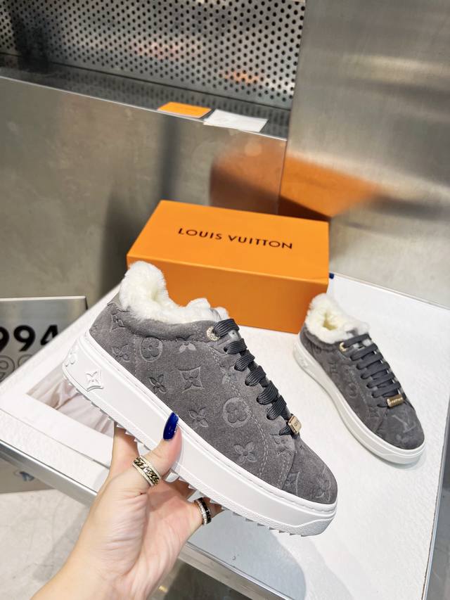 Lv This Time Out sneaker features suede calfskin with an embossed Monogram patte