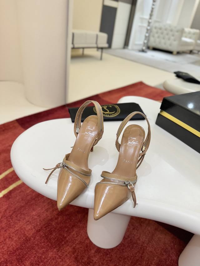 Zippered Shoes W. Maison Christian Louboutin. This shoe features a 100mm stilet