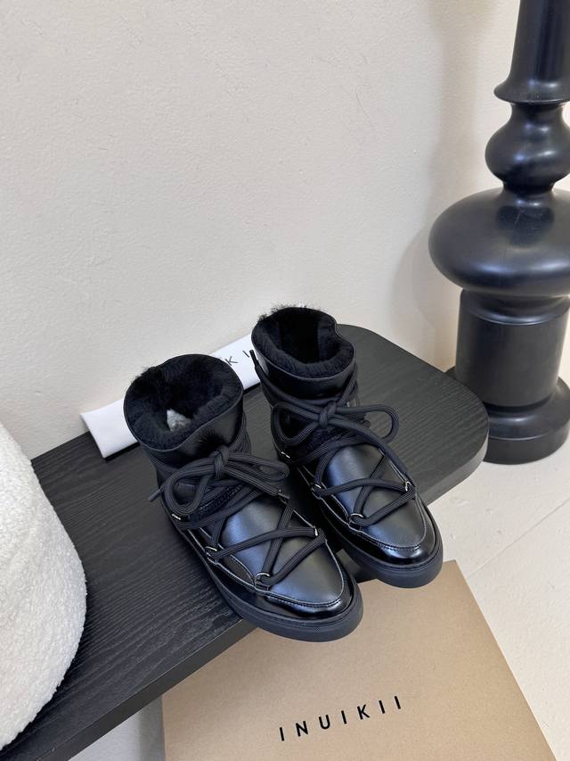 Inuikii Snow Boots. The upper is made of genuine cowhide leather, with a smooth,