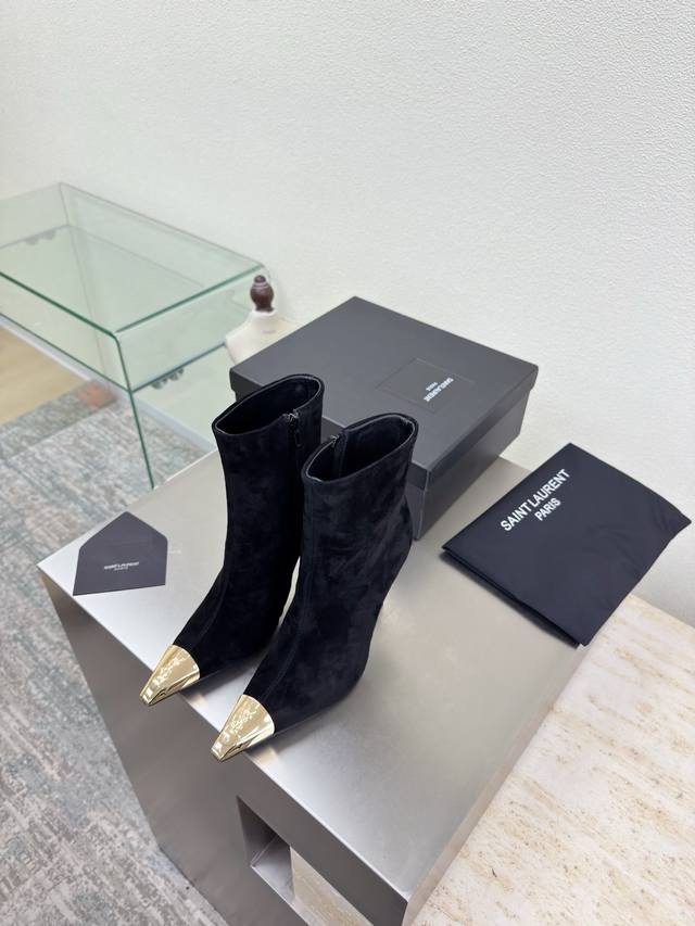 Must-have for long legs: YSL high-heeled ankle boots with metallic toe. Made wi