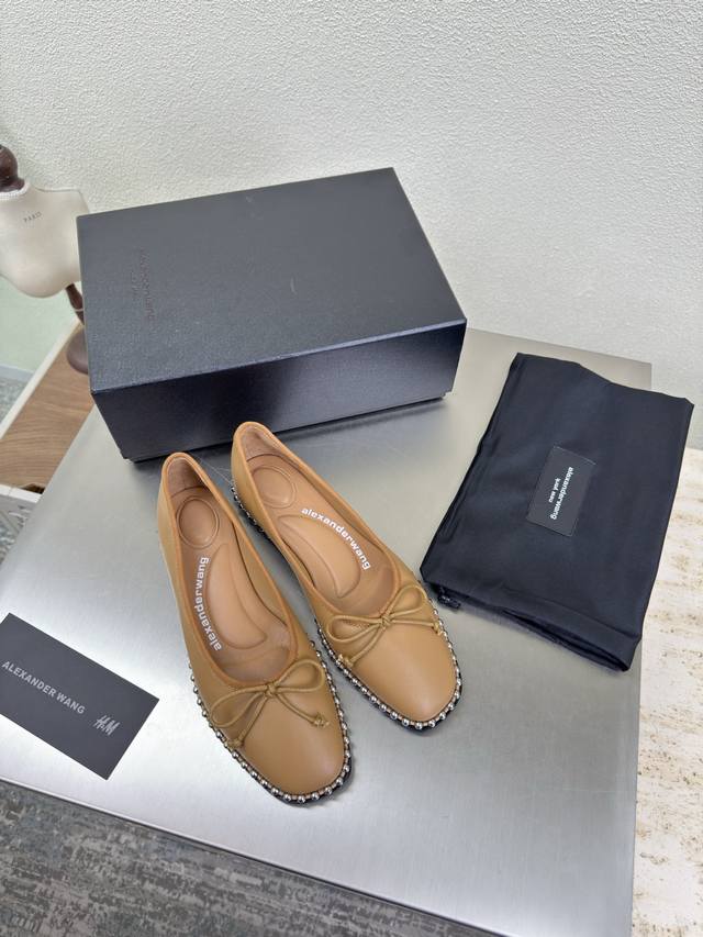 Flat shoes with a stylish design by Alexander Wags. Apricot sheepskin. Simple d