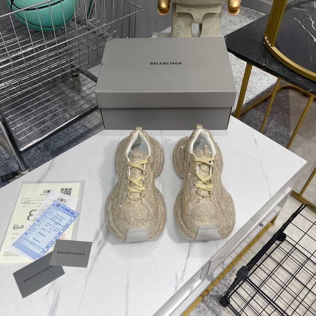 Factory-made top-tier version with rhinestone accents, distinguishing it from t