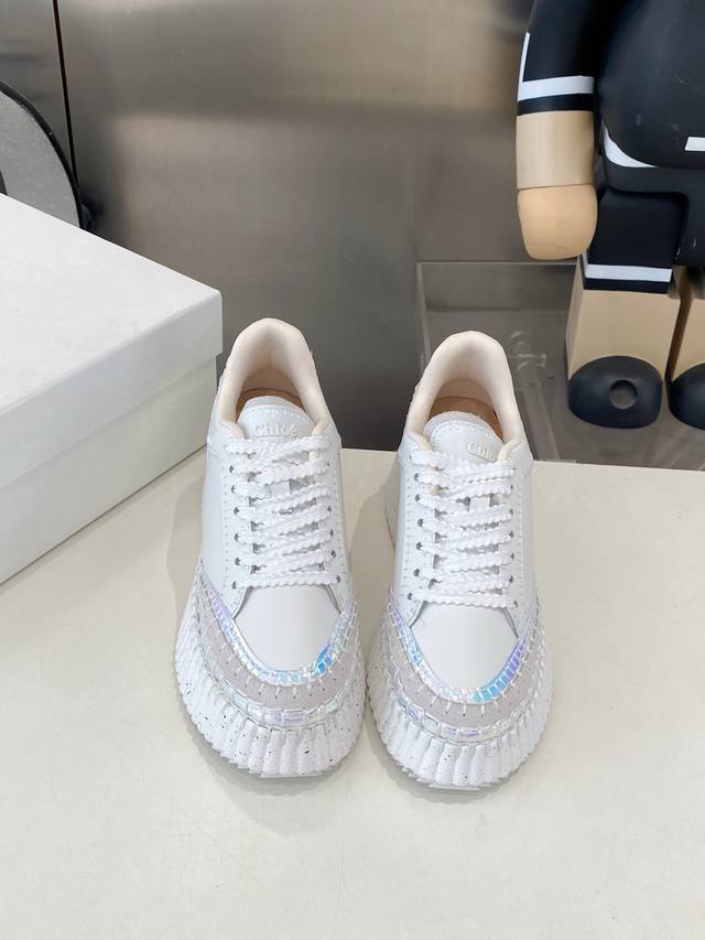 Manufactured in 2025, this new white sneaker from Chloe is now available in sto