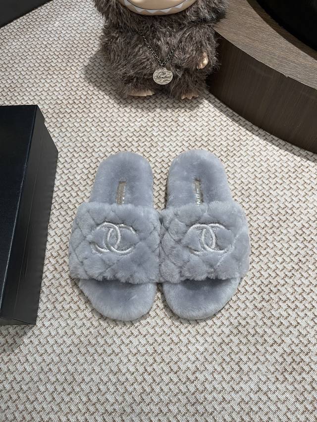 Chanel fur slippers. The entire pair is sourced from the original and developed