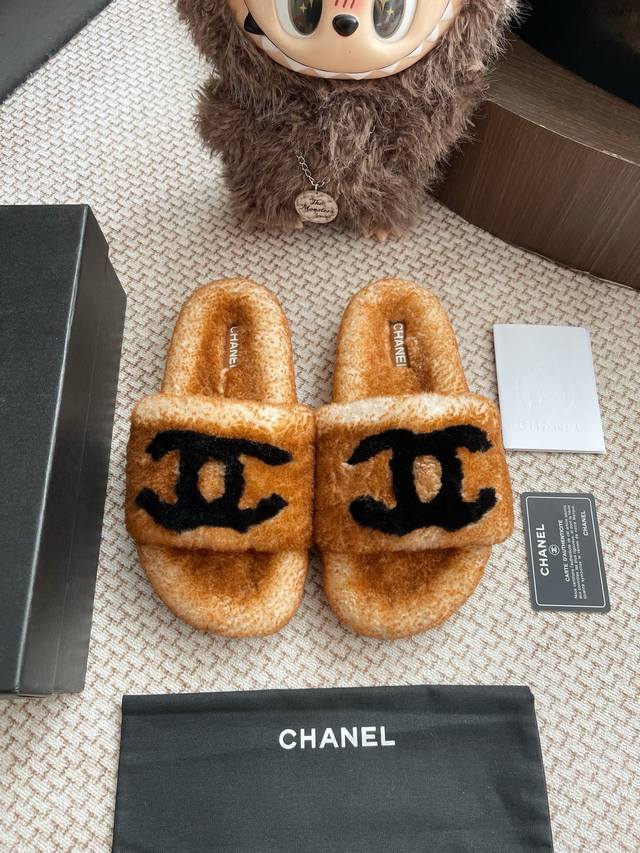 Chanel two-tone fur slippers. The entire pair is sourced from the original and