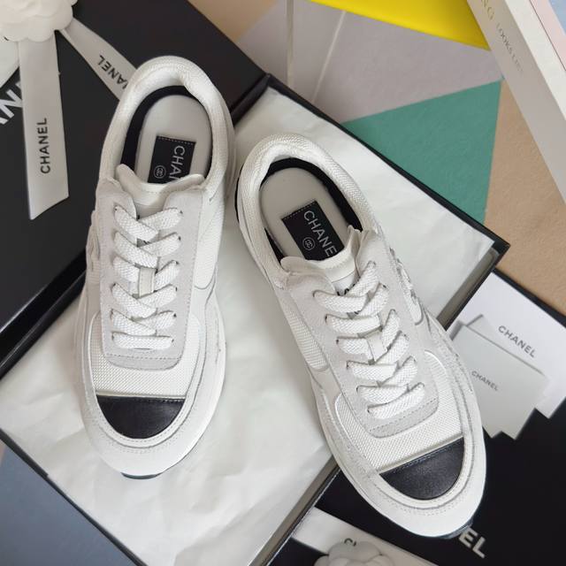 Retail Item: Women's Chanel 25K Black and White Panda Chunky Heel Sneakers. Orig