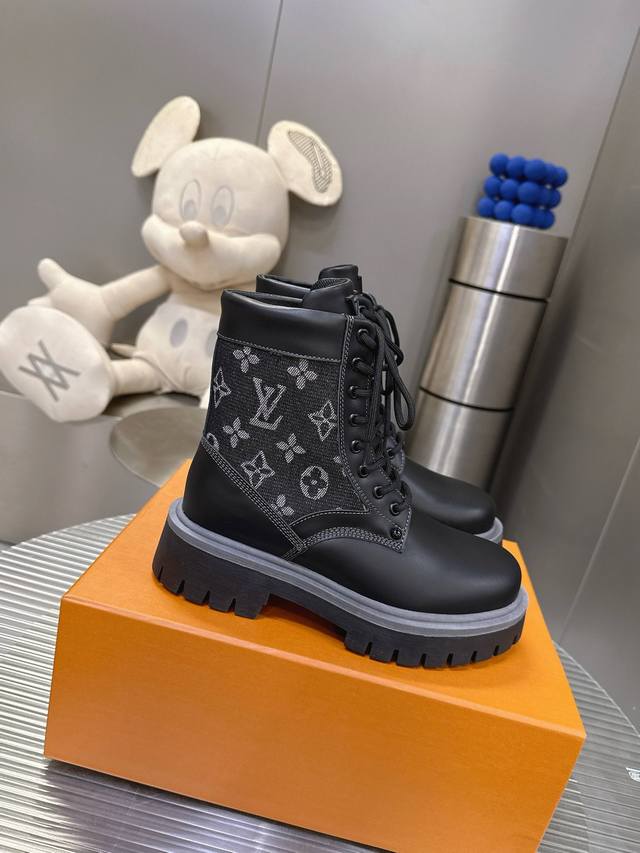 Louis Vuitton high-top platform Martin boots with leather and denim print. A win