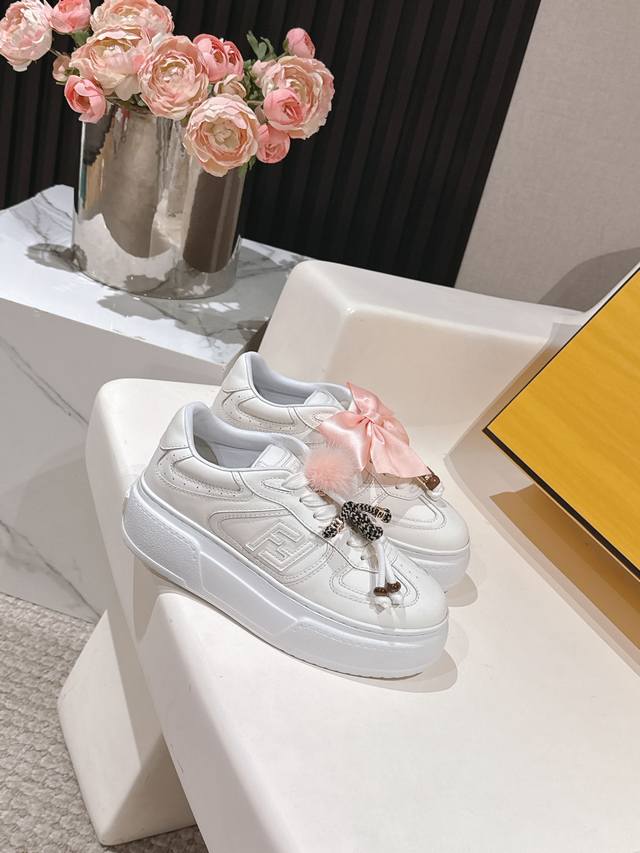 Fendi's latest Charm Match lace-up sneakers with an asymmetrical platform sole,