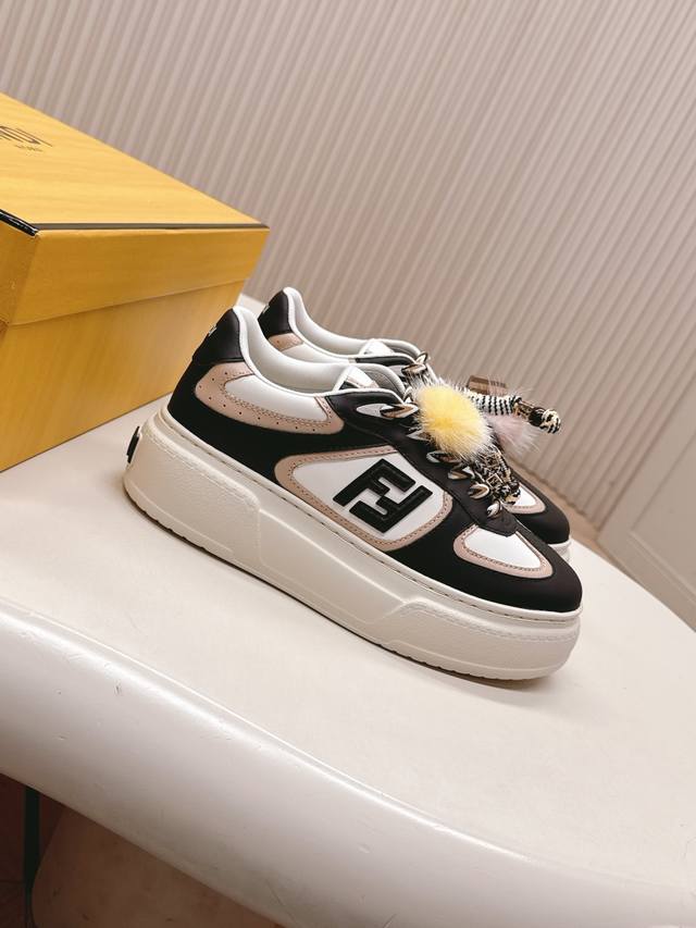 Fendi's latest Match asymmetrical magic platform Charm Match lace-up sneakers,