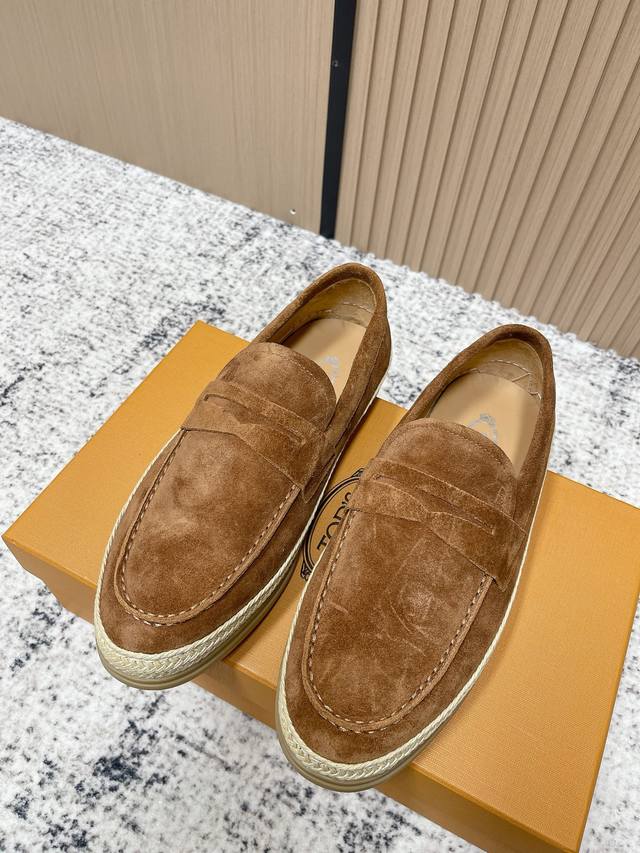 Top-tier version: Men's Tod's Loafers. These loafers are crafted from elegant im