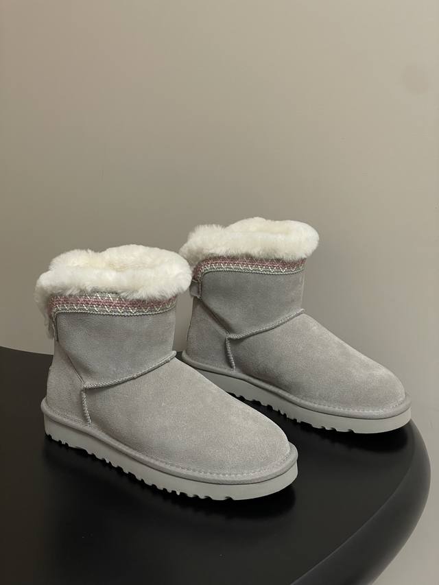 Ugg. Tired of classic shearling snow boots? Need some embellishment this year? K