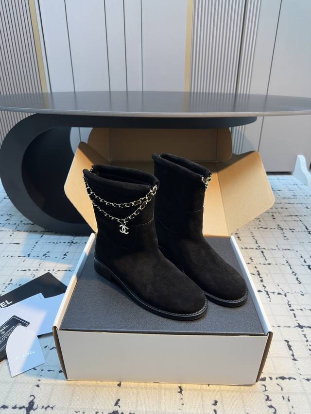 Chane* Double Chain Ankle Boots The boot shaft features Chanel's signature doubl