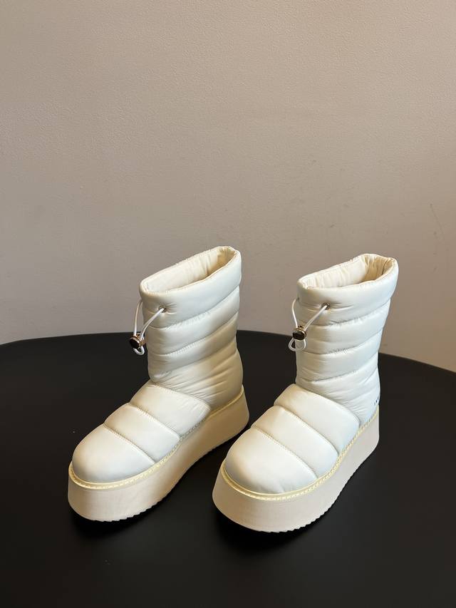 Inuikii 25Ss New Waterproof Down Snow Boots These boots feature down filling, cr