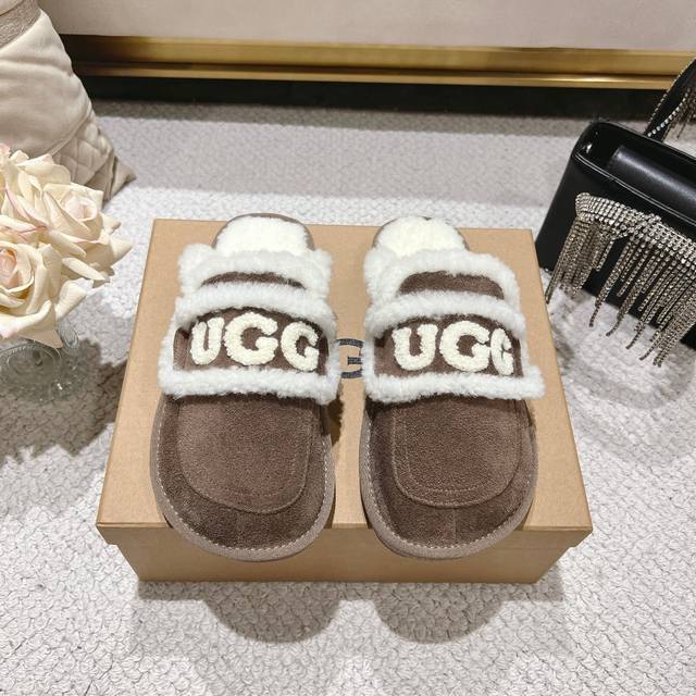 Champagne Brown Ugg Logo Slippers are so popular! The chubby, round toe design w