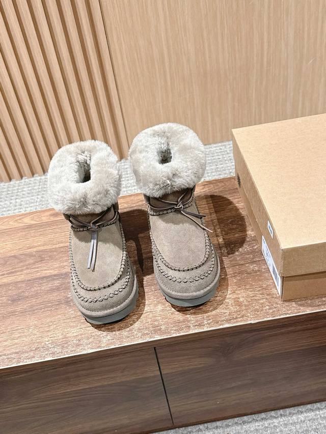 The Alpine Classic Mid-Calf Boots infuse warmth and style into every step of th