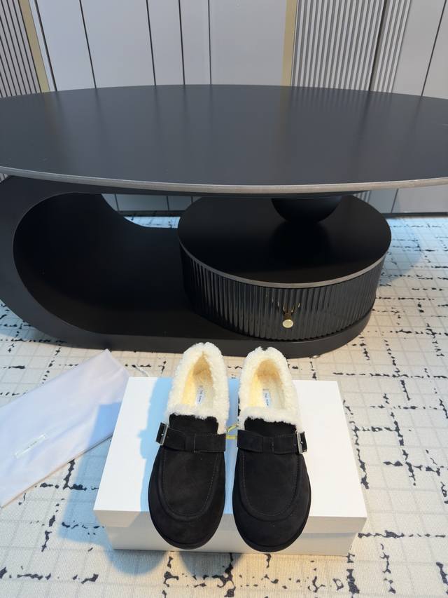 The Row Suede Loafers Made with fine suede, these loafers feature a soft fleece