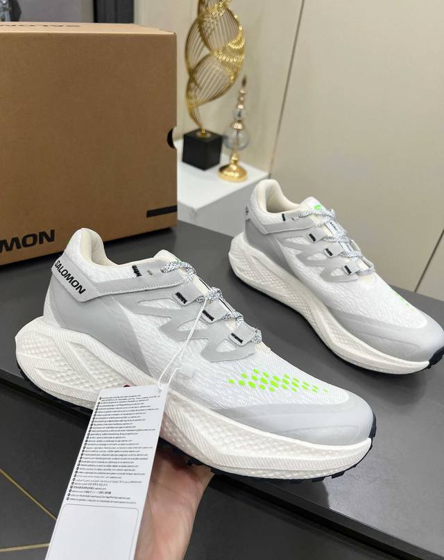 Salomon Odyssey Elmt Low Couple Sneakers Salomon, founded in 1947 at the foot of