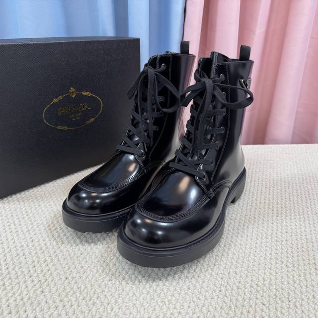 Top-tier classic men's Prada triangle buckle ankle boots, featuring a simple pa