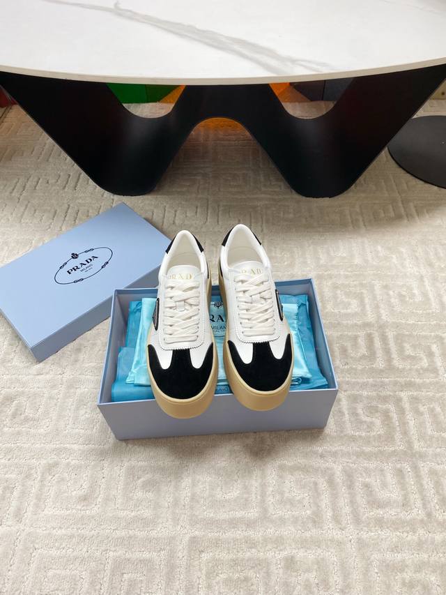 New Prada 25 platform casual sneakers. These sneakers continue the timeless sil New Prada 25 platform casual sneakers. These sneakers continue the timeless sil