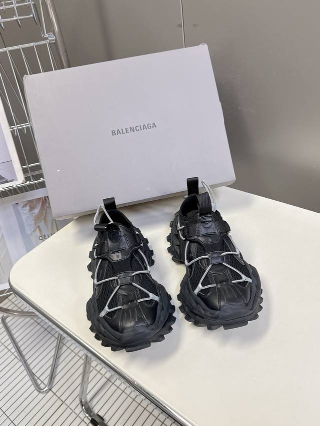 Balenciaga hiking boots, chunky sneakers, Paris Hike style. Features include adj